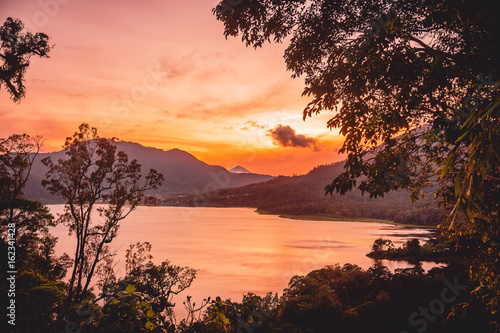 Sunset on the lake and mountains on Bali