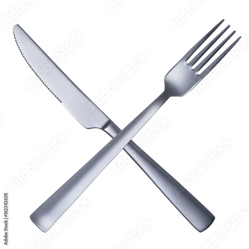 Silver matted metal knife and fork crossed isolated on white background
