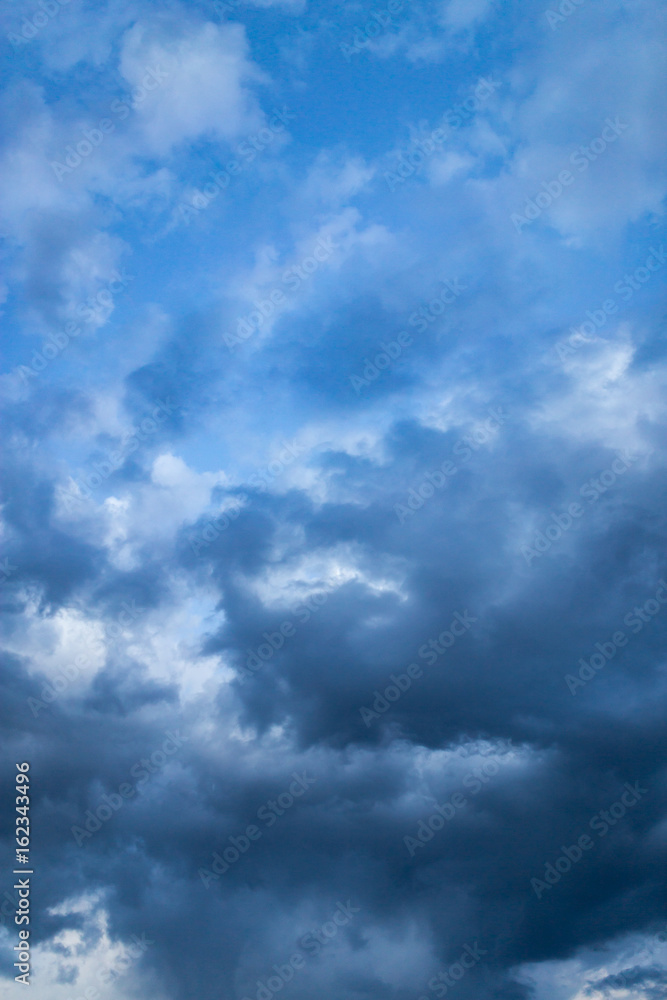 Beautiful clouds at sunset after rain as background .