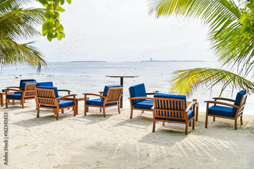 Chairs on the beach in Adaaran island,Maldives photo