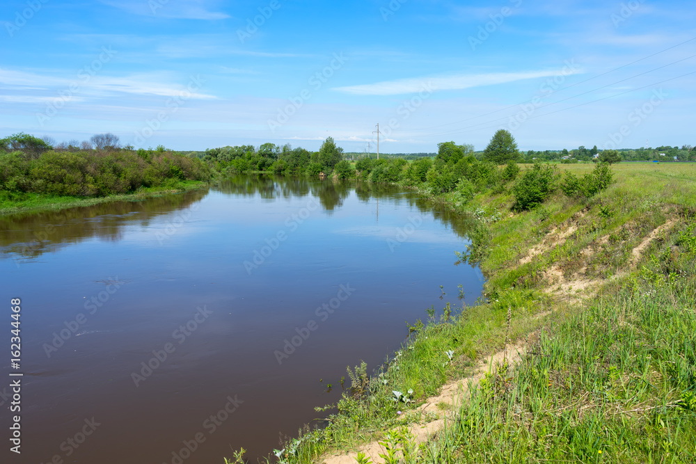 View on river valley with growth on bank
View on river valley with growth on bank