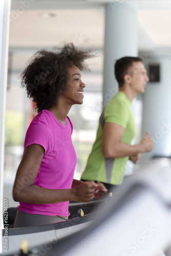 Fototapeta Naklejka Na Ścianę i Meble -  people exercisinng a cardio on treadmill
