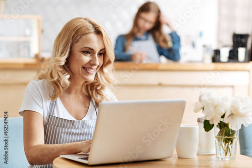 Attractive blonde woman reading an e-mail