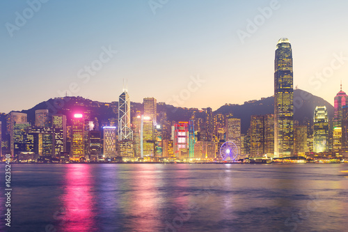 Cityscape and skyline at Victoria Harbour in Hong Kong city at twilight time. © DifferR