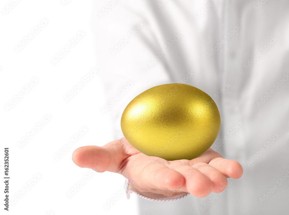 Hand Holding of golden eggs