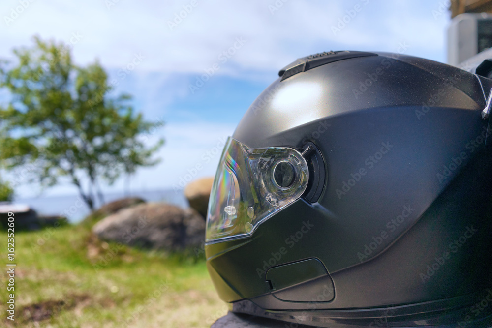 Helm of a motorcyclist on the beach Helm of a motorcyclist on the beach