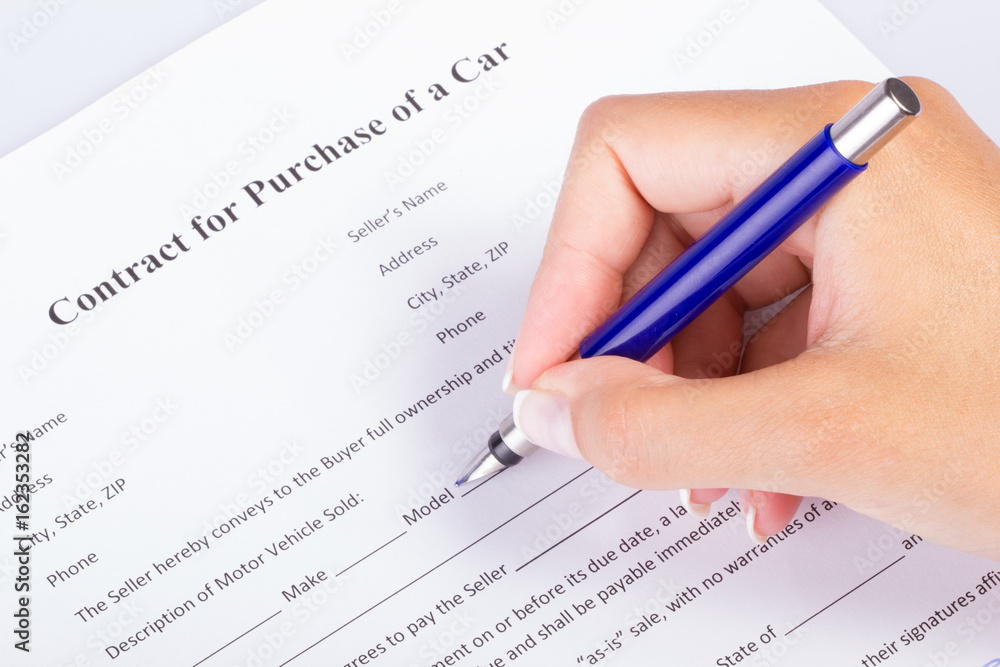 Car buyer going over the contract, first person view angle Car buyer going over the contract, first person view angle