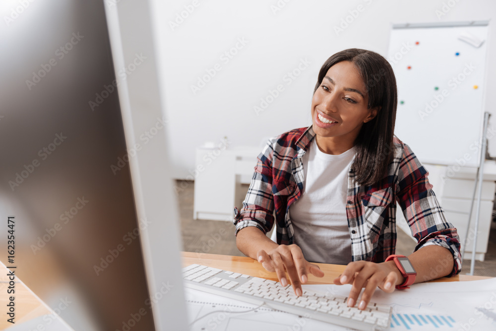 Positive hard working woman typing on the keyboard Positive hard working woman typing on the keyboard