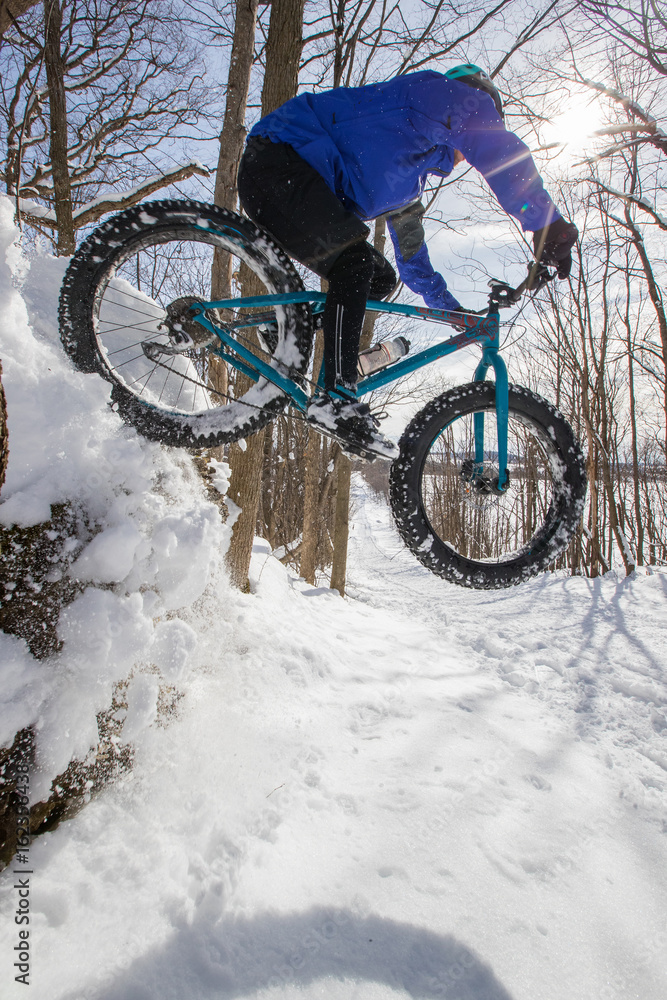 Man riding his fat bike in the snow