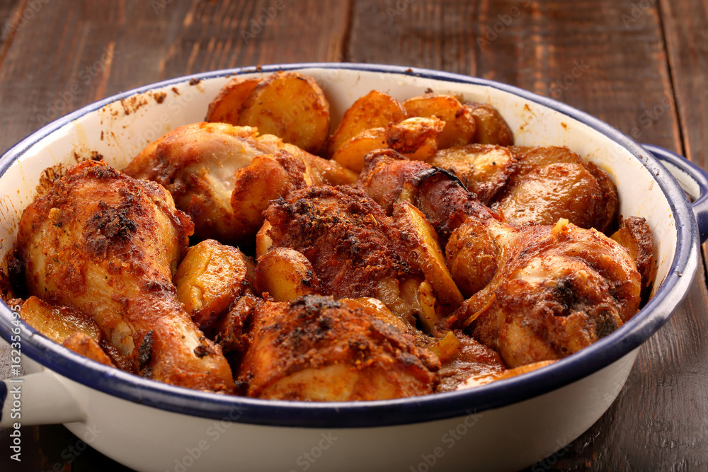 Roasted chicken legs with potato chips Roasted chicken legs with potato chips