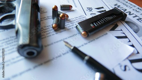 Wallpaper Mural An announcement about the search for a criminal on the table of the bounty hunter, a combat pistol, cartridges Torontodigital.ca