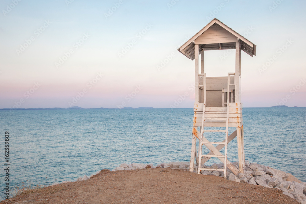 lifeguard stand beside the beach in the evening scene lifeguard stand beside the beach in the evening scene
