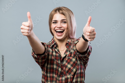 Cute girl with thumbs up