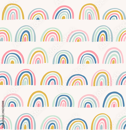 Hand drawn geometric abstract pattern. Cute rainbow vector seamless background in doodle style. Bright colors.