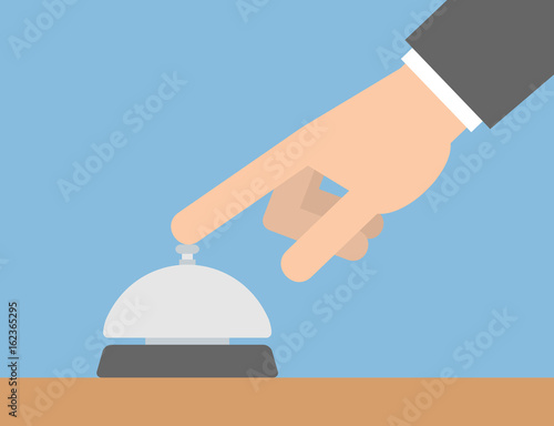 Hand pushing the service bell button concept