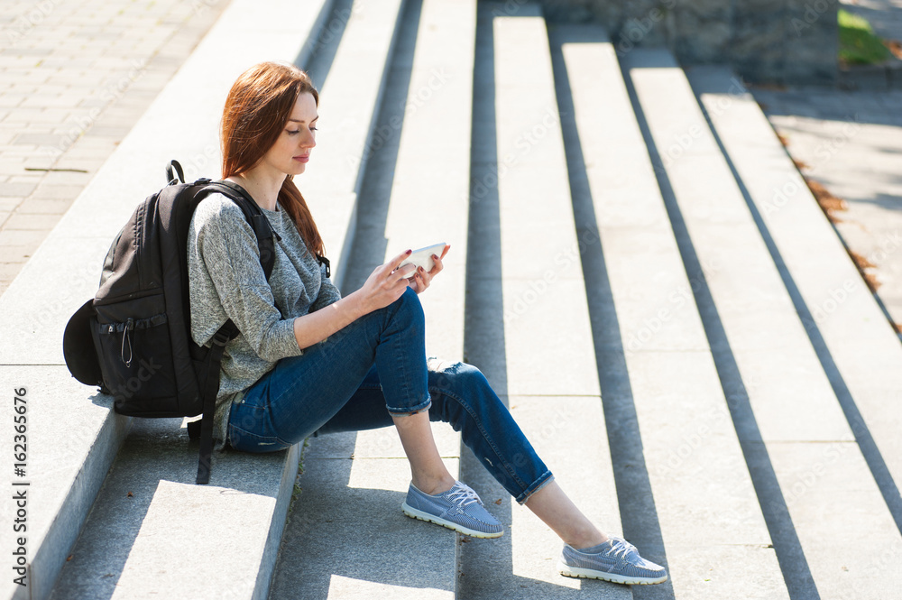 girl sitting on stone steps 04