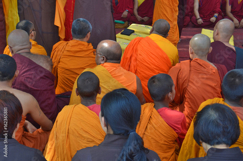 Buddhist devotees, back of the head view.