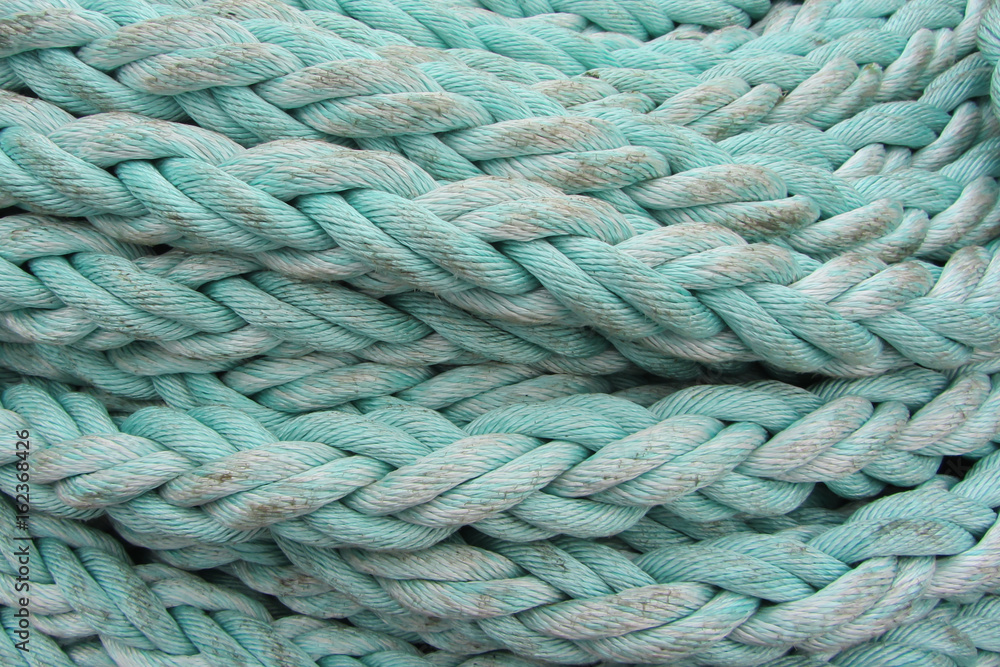 Light-blue sea hemp rope, background, close-up Light-blue sea hemp rope, background, close-up