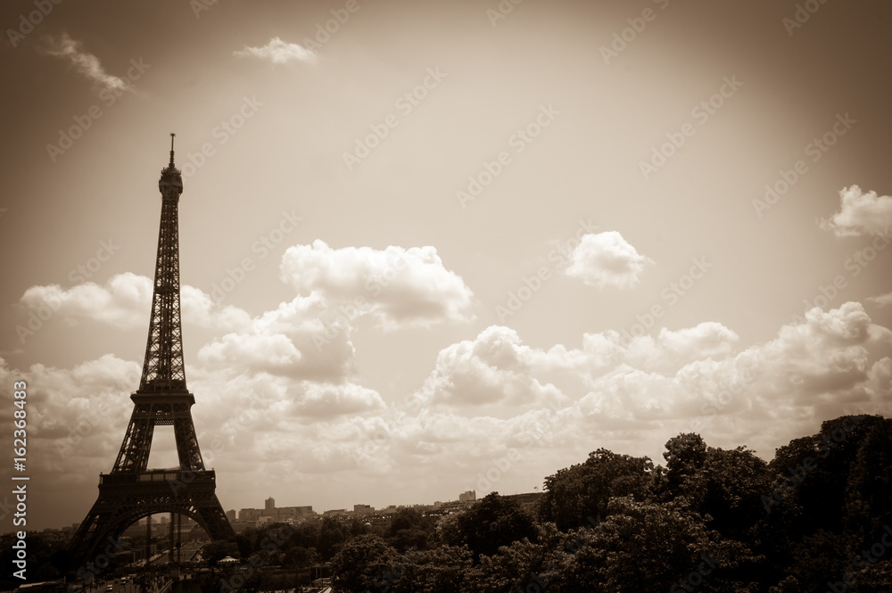 Eiffel tower and Parisian landscape. Sepia. Vignette.