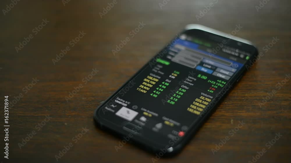 Checking stock market prices on smartphone Checking stock market prices on smartphone