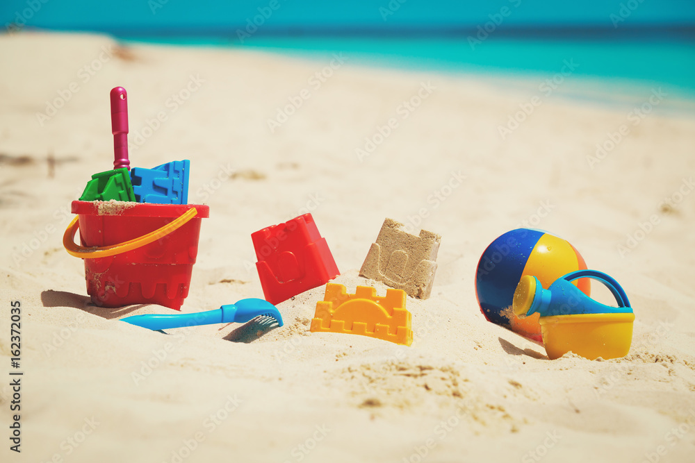 kids toys on tropical sand beach kids toys on tropical sand beach