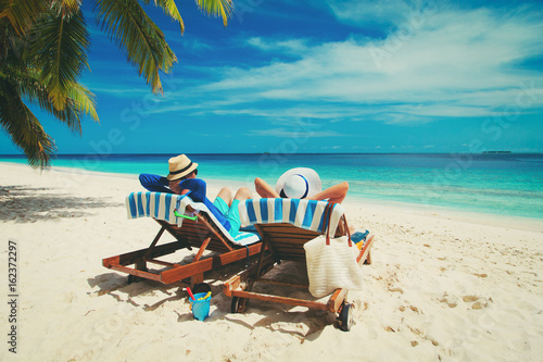 happy couple relax on a tropical beach