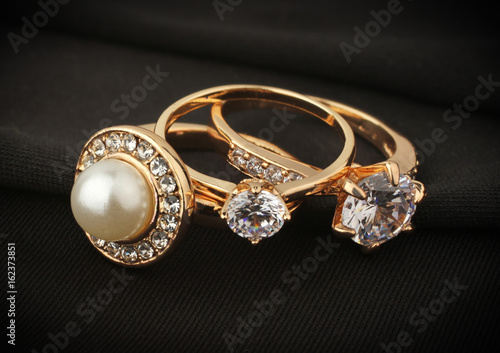 jewelry rings with diamond on black cloth, soft focus