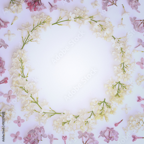 Decorative vintage frame made of lilac flowers. View from above.
