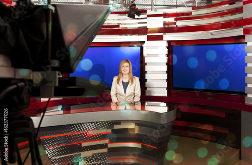 A television anchorwoman at studio photo