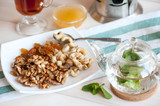 Healthy breakfast: nuts mix and mint tea