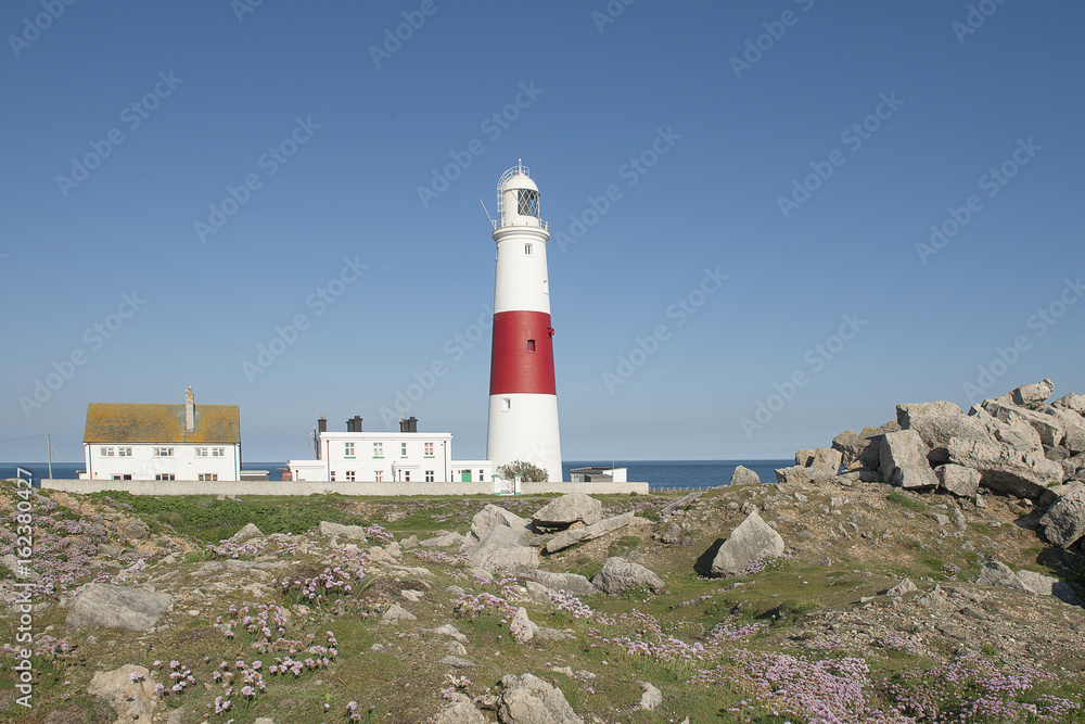 Lighthouse of the isle of portland on a sunny day on a blue sky