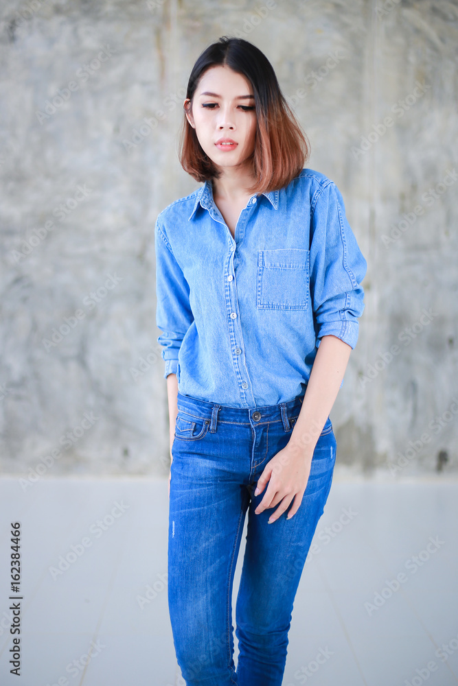 Asian woman casual outfits standing in jeans and blue denim shirt women brown hair and short hair beauty and fashion jeans concept Stock Photo Adobe Stock