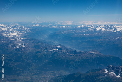 Aerial view of the alps in summer shot from a plane