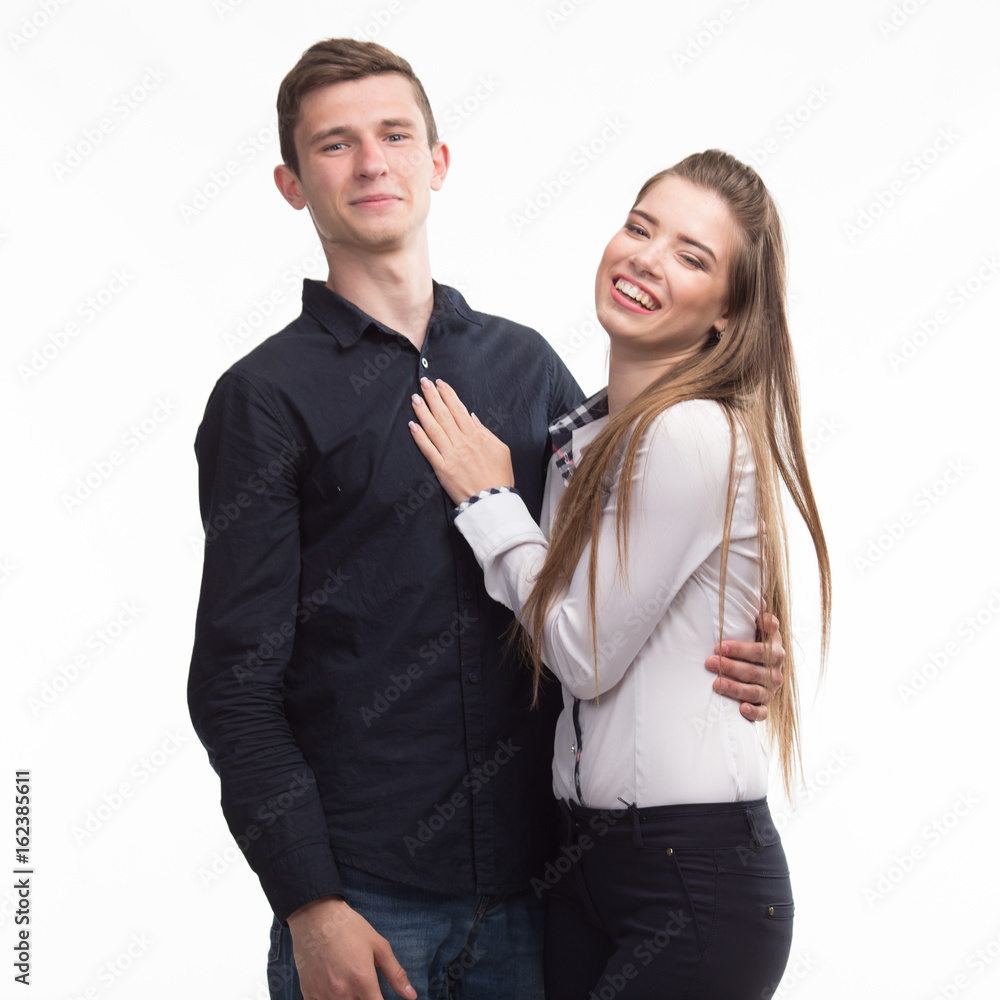 Young happy couple portrait of a confident businessman on a gray background. Ideal for banners, registration forms, presentation, landings, presenting concept. Young happy couple portrait of a confident businessman on a gray background. Ideal for banners, registration forms, presentation, landings, presenting concept.