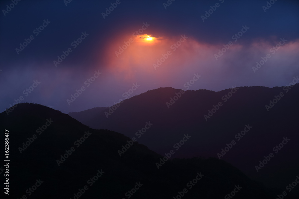 mountain range tropical rainforest canopy at southern of Thailand with more  cloud sunset time