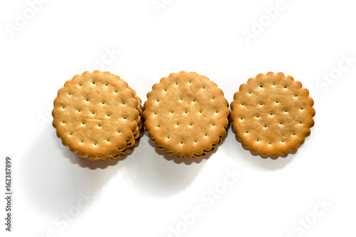 A stack of cicle biscuits puff sandwich cream isolated on white