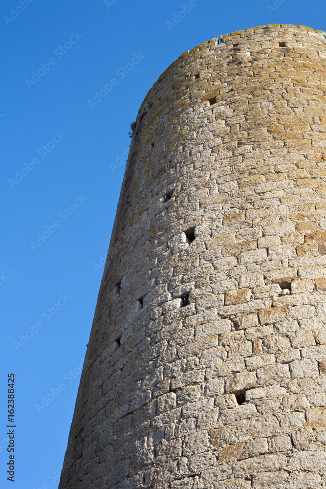 Cylindrical stone tower in San Pere de Pals, Catalonia, Spain