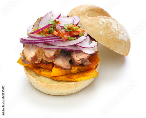 pan con chicharron, peruvian pork sandwich isolated on white background