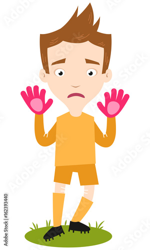 Shy and anxious looking caucasian cartoon goalkeeper wearing yellow shirt and shorts moving backwards isolated on white background