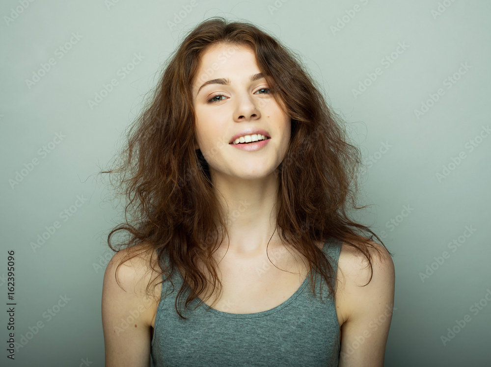lifestyle and people concept: Young casual woman portrait. Clean face, curly hair. lifestyle and people concept: Young casual woman portrait. Clean face, curly hair.
