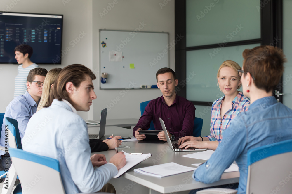 Business Team At A Meeting at modern office building Business Team At A Meeting at modern office building