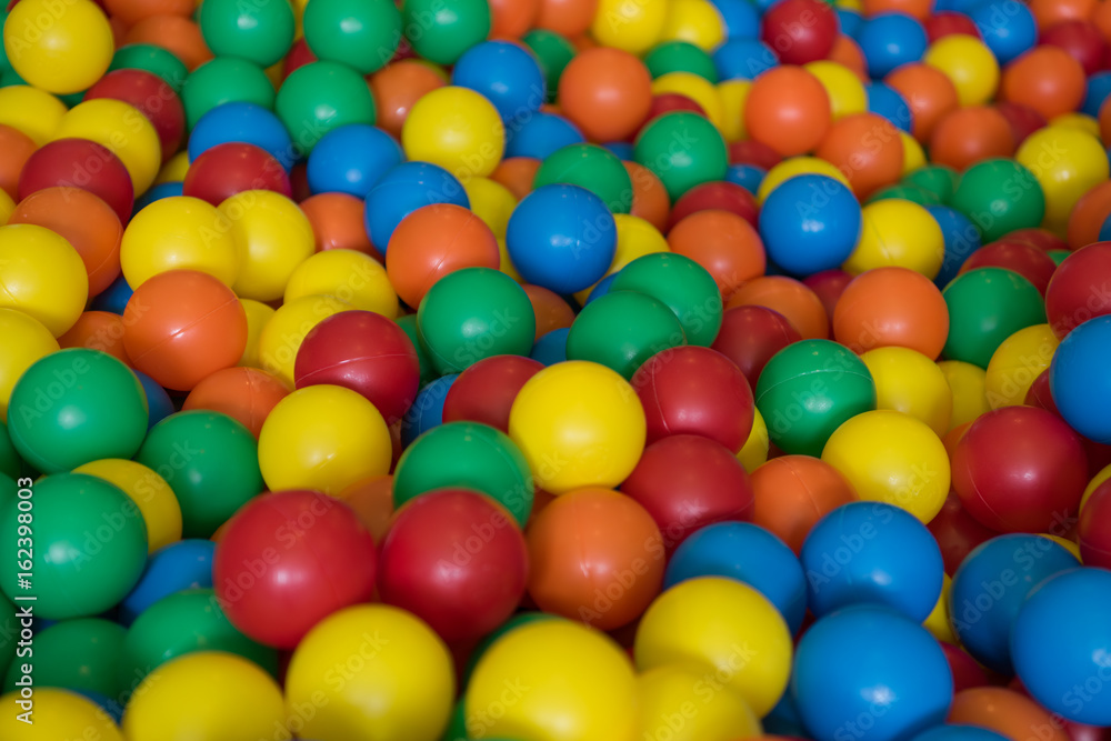 Colorful plastic toy balls in the play pool Colorful plastic toy balls in the play pool
