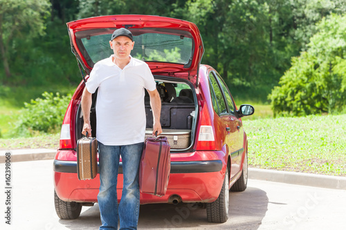 man travel suitcases car summer landscape © Elroi