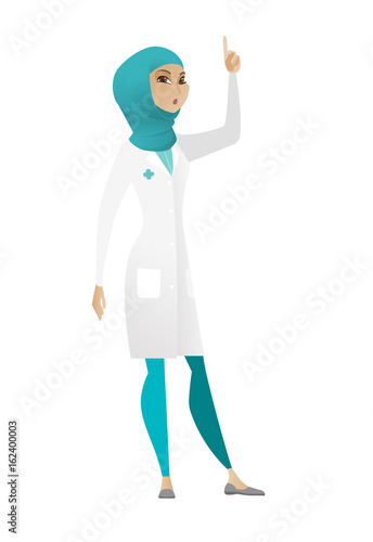 Doctor with open mouth pointing finger up.