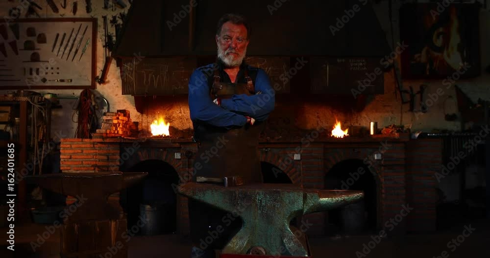 Portrait of confident blacksmith in his workshop Portrait of confident blacksmith in his workshop