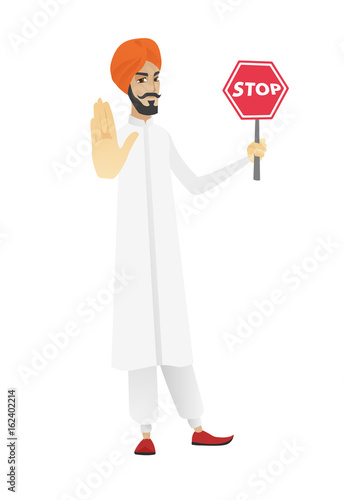 Hindu businessman holding stop road sign.