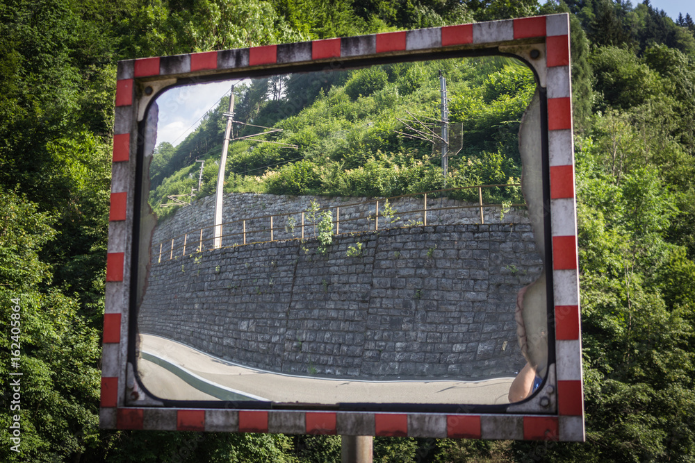 Obraz premium a traffic mirror with reflection, reflection, traffic, mirror, wall, street, road, reflex, mirroring, speculum examination, road safety, roadworthiness
