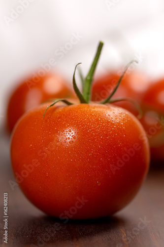 Fresh Tomato covered in dew