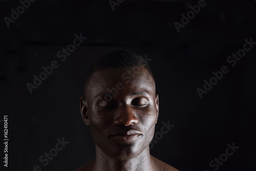 African man wilth eyes closed