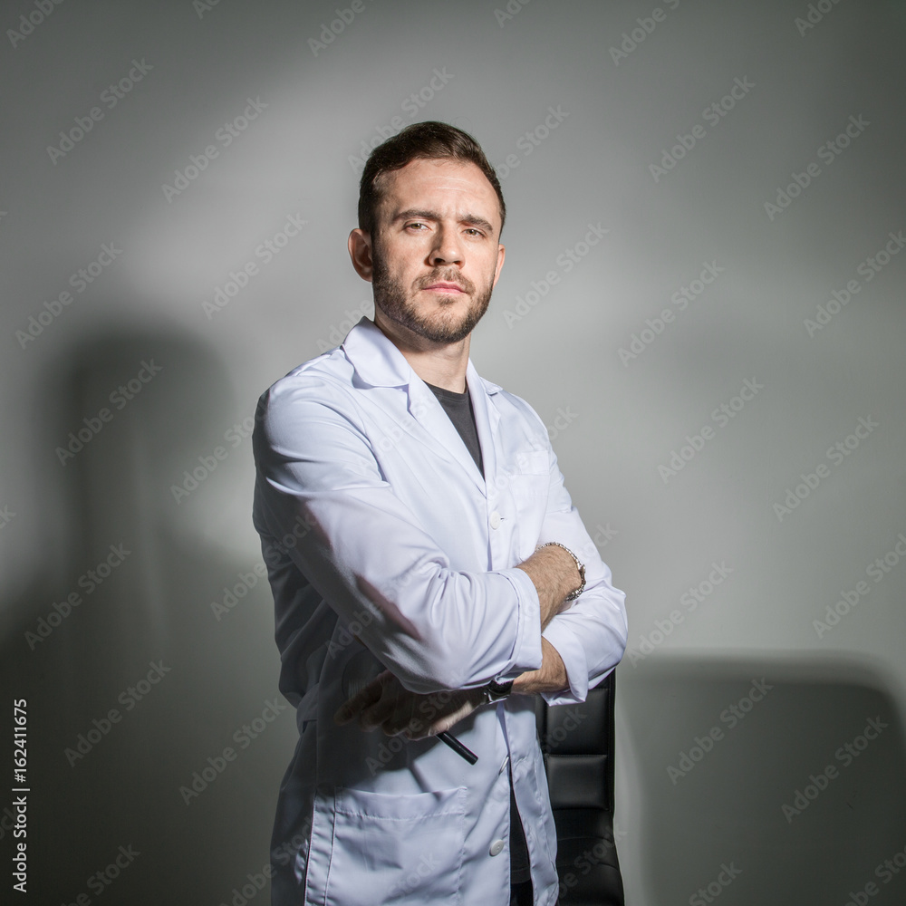 A man in a white robe looking right A man in a white robe looking right